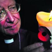 Bishop of Oxford, the Rt Rev John Pritchard, with a candle ahead of last night’s vigil at Christ Church Cathedral