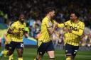 Oxford United celebrate after taking the lead from the penalty spot