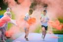 Runners make it past the orange station during the Rainbow Run. Pictures: Damian Halliwell