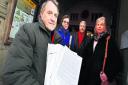 Campaigners Martin Tasker, left, Judith Harley, Tony Greenfield and Sandra Tasker and their petition objecting to the Haboakus development in Barns Road
