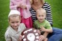 Joanna Buddin with the tournament trophy and her children Ashley May, four, Kayleigh, six, and Jaycob, two