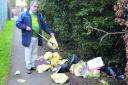 Councillor David Williams picking rubbish on the footpath from the Donnington Bridge Road to the Donnington Community Centre
