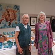 Vivien Sieber (potter and author) and her husband.
Bull Artwork at back by Andrew Southwick