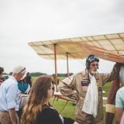 Pilot with historic plane at Bicester Heritage