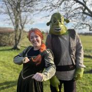 Moonlight walkers dressed as Shrek and Fiona