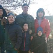 Yuliya and Ruslan Panchyshyna, with their four sons Yura, Roma, Vova and Ruslan.