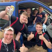 Firefighters at Bicester Fire Station's annual charity car wash. Credit: Bicester Fire Station