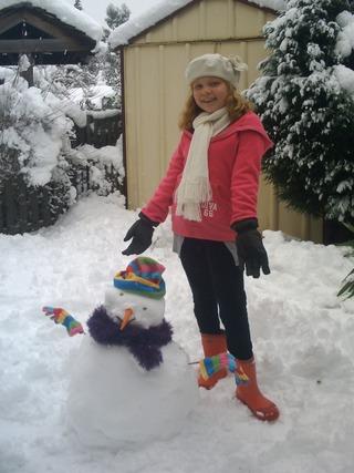 Alice Boyle, 9, of Courtland Road, Oxford, with her snowman.