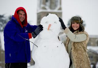James Messenger (29) and  Megan David (26) build a snowman on Church Green Witney
Pic: Mark Hemsworth