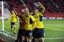 James Henry celebrates his goal with John Mousinho and Ryan Ledson, during the match at The Valley in February 2018. Picture: David Fleming