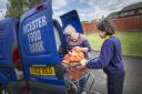 Bicester food Bank founder Janet Ray and pupil from Langford Village School