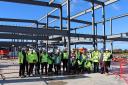 A group shot as the steel frame goes up at the new Graven Hill primary school