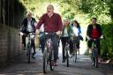 LibDem leader Sir Ed Davey alongside West Country MPs and key candidates as they arrive by bicycle for the Liberal Democrat conference (Stefan Rousseau/PA)