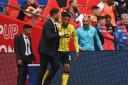 Oxford United boss Des Buckingham gives instructions to Marcus McGuane before he takes to the field at Wembley