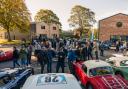 Crowds with cars at Bicester Heritage's latest Scramble event