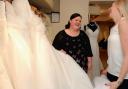 Boutique owner Hannah Bathe advises Jemma McCarthy as she looks at the gorgeous dresses available in her size at Mae Bridal