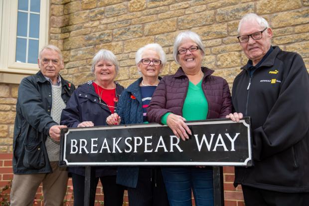 Bicester Advertiser: The Breakspear family stood behind the road sign named after their family members who died in the World Wars, including Bob Breakspear, Trish Turner, Jean Mutch, Julie Winney and John Winney