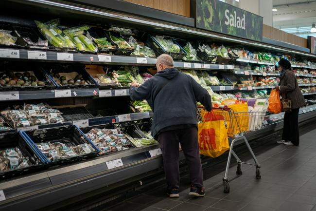 Shoppers in the fruit and vegetables section of a branch of Sainsbury's in London (PA)