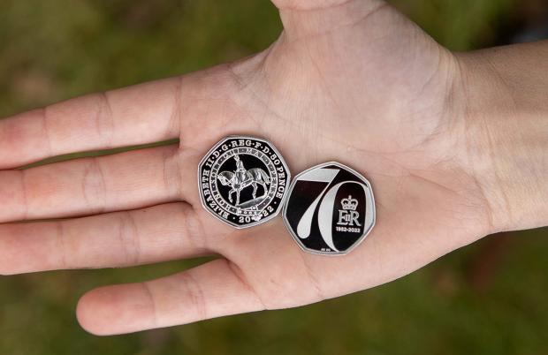 Bicester Advertiser: The new Platinum Jubilee 50p which will be gifted to 7,000 children completing the QGC Forestry Award. (The Royal Mint) Ltd 