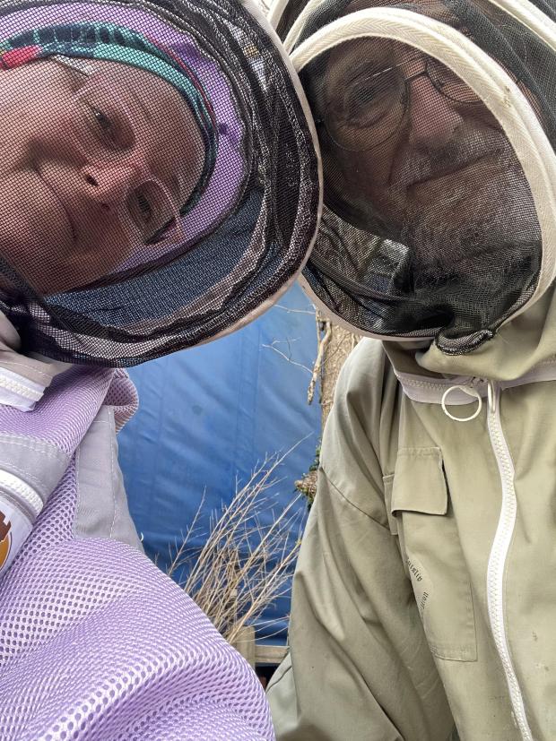 Bicester Advertiser: Kate Newman, age 43, and her father, age 77, beekeeping.