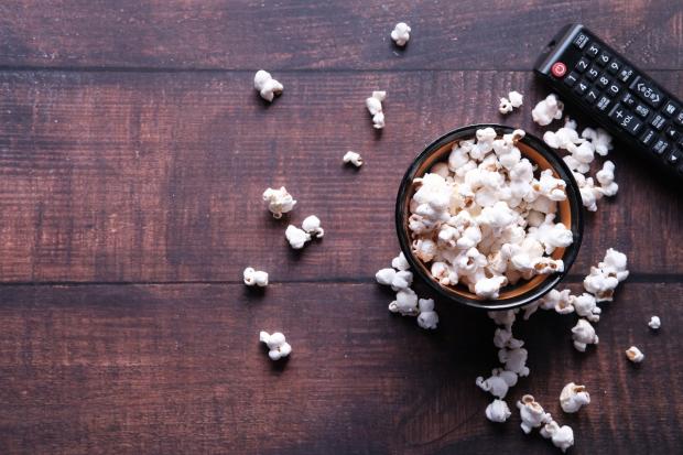 Bicester Advertiser: A bowl of popcorn and a TV remote (Canva)