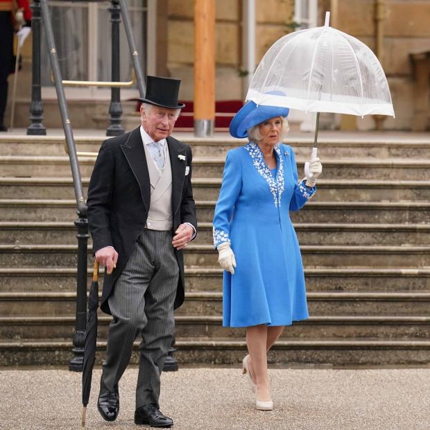 Bicester Advertiser: The Prince of Wales and the Duchess of Cornwall during a Royal Garden Party at Buckingham Palace. Picture: PA