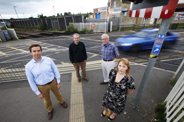 Bicester Advertiser: County councillors Calum Miller, Les Sibley, Michael Waine and Donna Ford at the London Road level crossing. Picture: Ed Nix