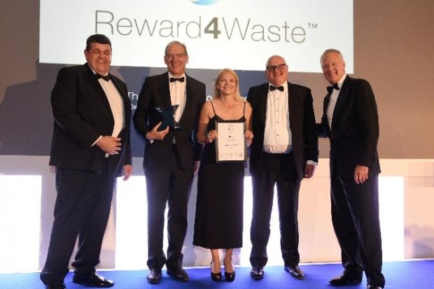 Receiving the Excellence in Technology Award: L-R Neill Lawson-Smith CIS Ltd; Steve Clarke, CEO, Cryptocycle; Rachel Warren, marketing director, Cryptocycle; Tony McGurk, Chairman, Cryptocycle; Rory Bremner.