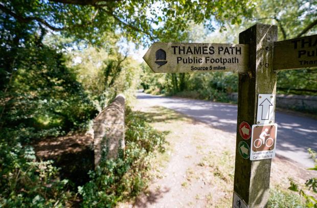 Bicester Advertiser: A view of a signpost for the Thames Path near to Somerford Keynes. Picture: Andrew Matthews/PA