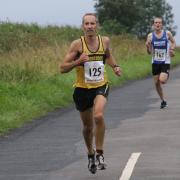 Race winner James Bolton leads the way at the Alchester 5k Picture: Barry Cornelius