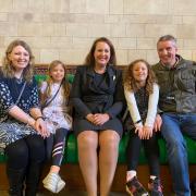 WINNER: Isabelle with her family and MP Victoria Prentis