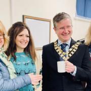 Bicester Mayor Alex Thrupp (centre right), Amanda Claire Lewin (centre left) and volunteers at the Ukrainian Clothes Centre in Bicester