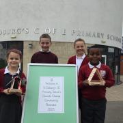 Four school children taking part in St Edburg's climate change week. Credit: St Edburg's School