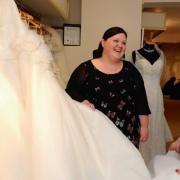 Boutique owner Hannah Bathe advises Jemma McCarthy as she looks at the gorgeous dresses available in her size at Mae Bridal