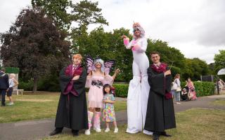 Unicorn stilt walker with Harry Potter and Ron Weasley lookalikes. Photo credit: Eddy Xi Gong