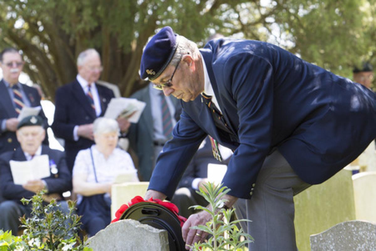 Major John Howard's second cousin Derek Chivers lays a wreath at his grave. Picture Damian Halliwell